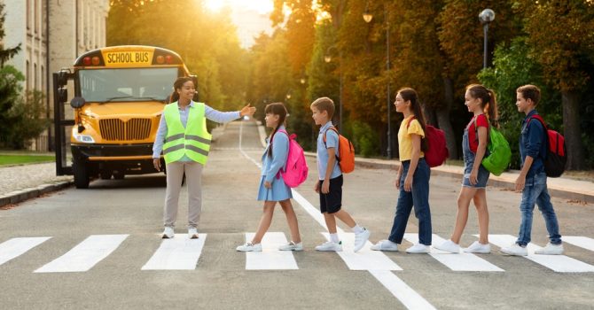 Road,Traffic,Safety.,School,Bus,Assistant,Lady,Helping,Kids,To Road,Traffic,Safety.,School,Bus,Assistant,Lady,Helping,Kids,To